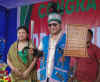 Click to enlarge Dr Mukul Sangma with a Milam and Danil (sword and shield) during the felicitation programme held at Ampati