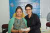 Click to enlarge Ampareen Lyngdoh Minister Urban Affairs hand over the cheque to one of the school during the implementation of IEDSS Scheme