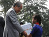 His Excellency Shri R.S. Mooshahary Governor of Meghalaya presenting the Rajya Puraskar Award to the student of Bharat Scouts and Guides