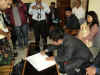 Click to enlarge Dr. Mukul Sangma, CM, Meghalaya signing the enumeration document in the presence of the DC and Principal Census Officer West Garo Hills