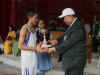 Meghalaya CM, Dr D D Lapang handing over the Boys winners' trophy of the Chief Minister Inter School Basketball Tournament to the Captain of Alpha English School, Nongpoh
