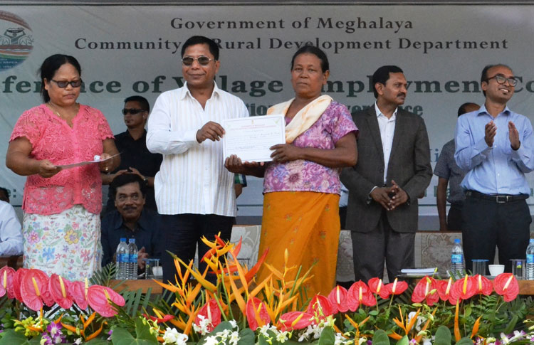 Click to enlarge CM Dr Mukul Sangma presents awards to best performing fair price shop dealers during the conference of VECs